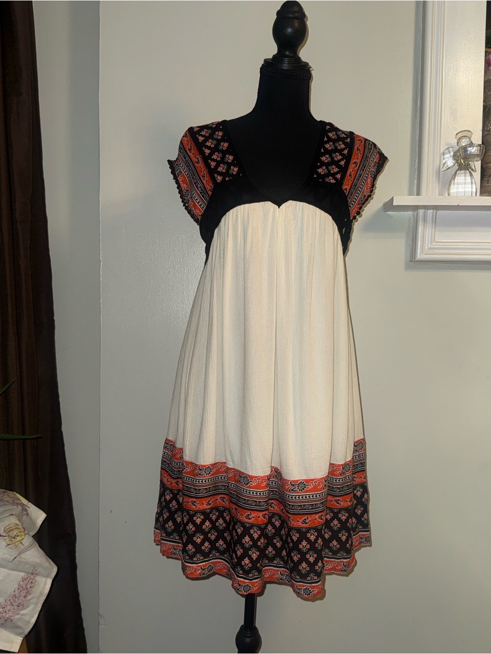the clothing company Cream Midi Dress with Black Yoke and Orange Border Print